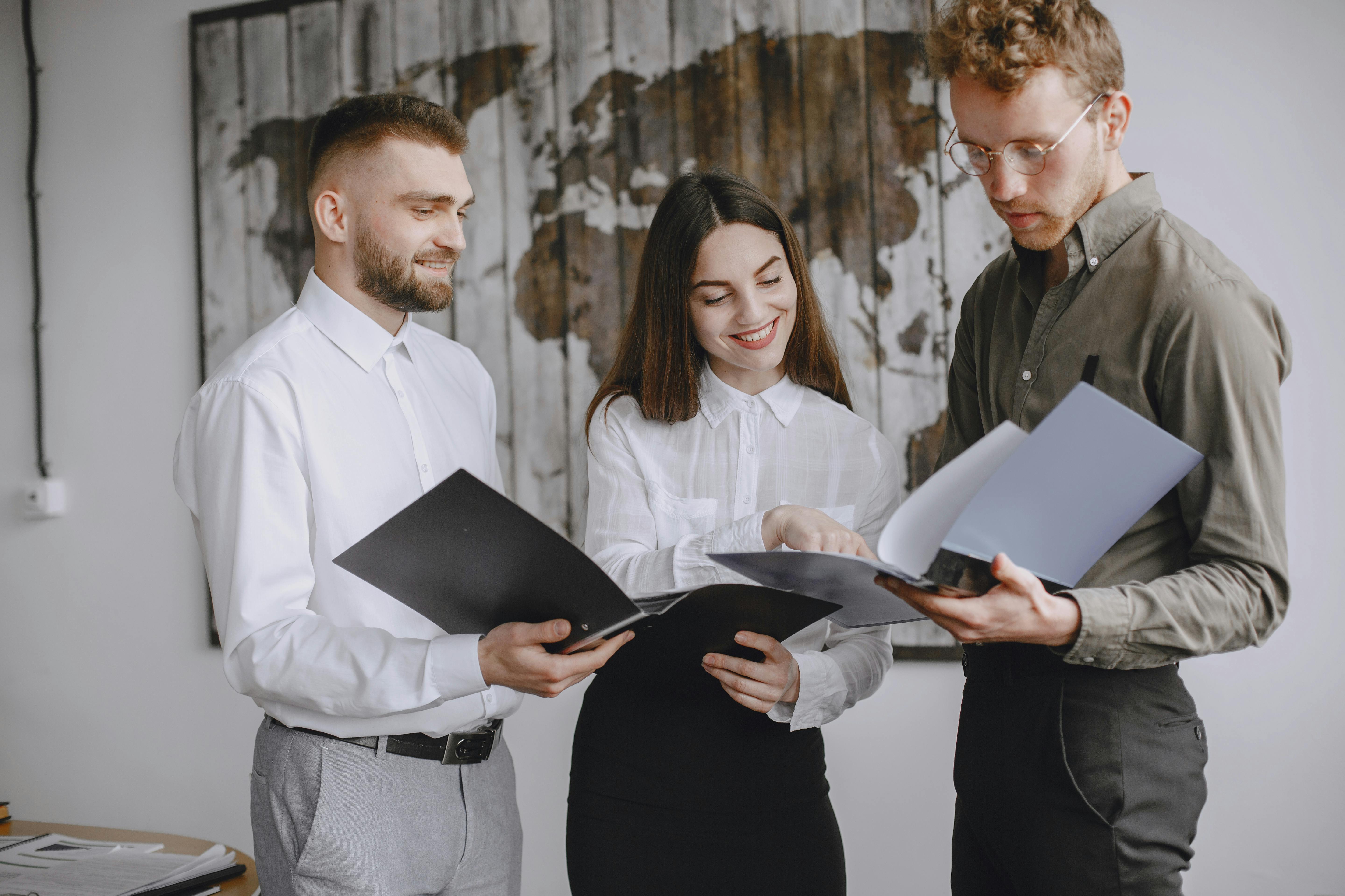 Professionals collaborating on documents in an office
